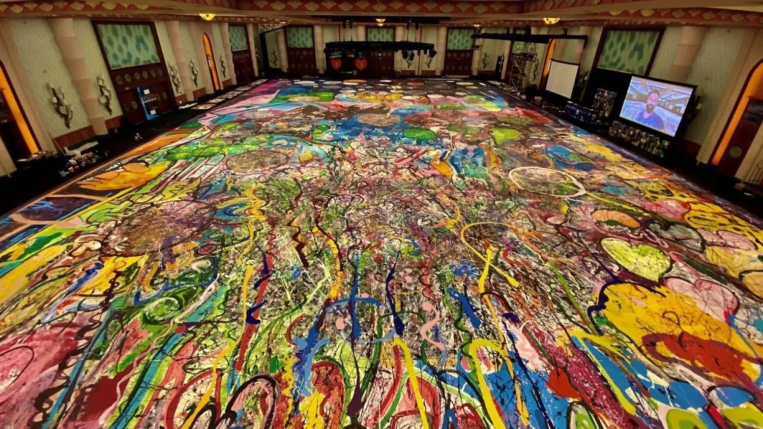 The original painting, “The Journey of Humanity” by British artist Sacha Jafri, holds the Guinness World Record for the largest art canvas. (Reuters)