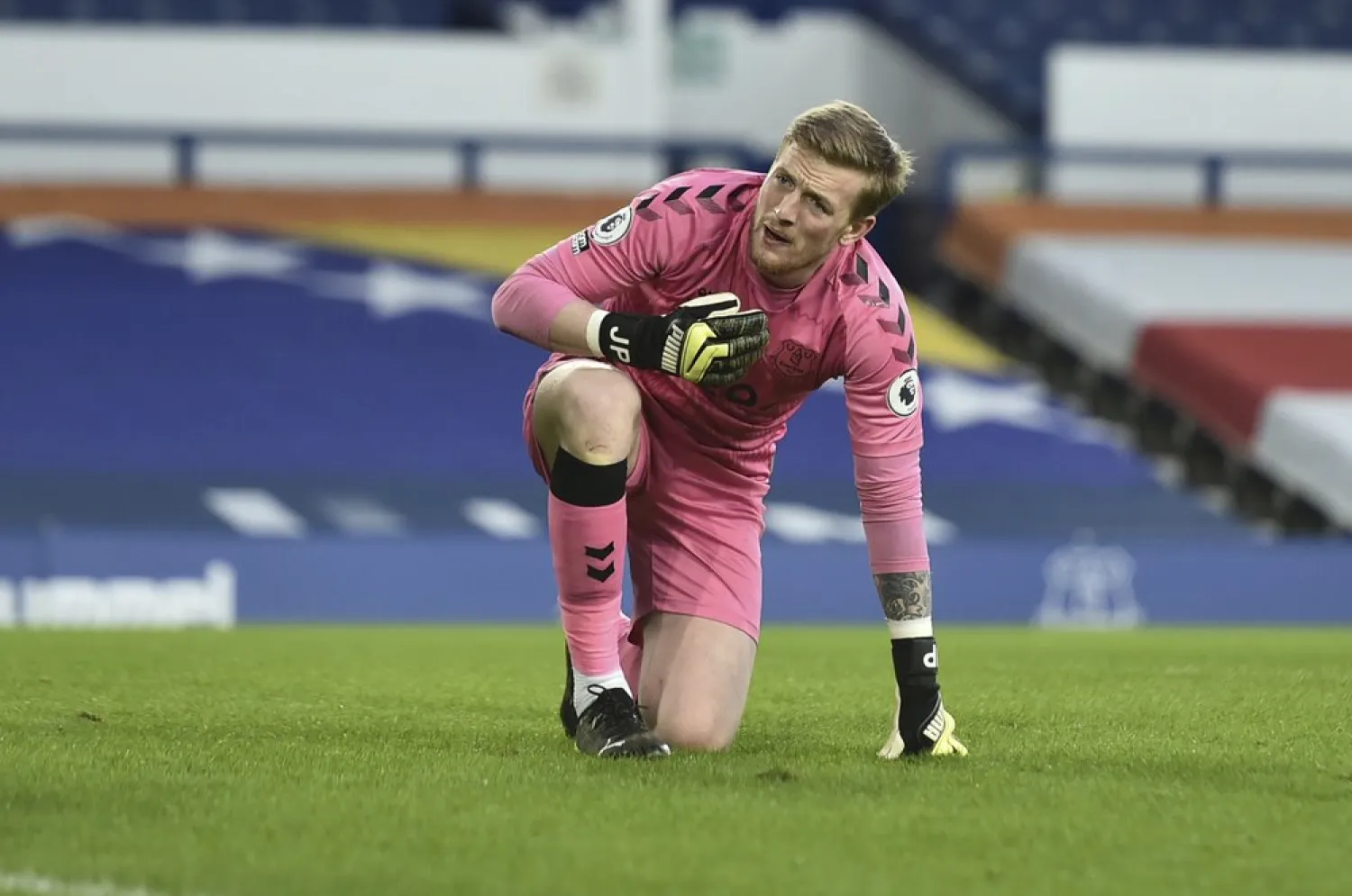 Everton's goalkeeper Jordan Pickford reacts after sustaining an injury during the Premier League match between Everton and Burnley at Goodison Park in Liverpool, England, March 13, 2021. (AP)