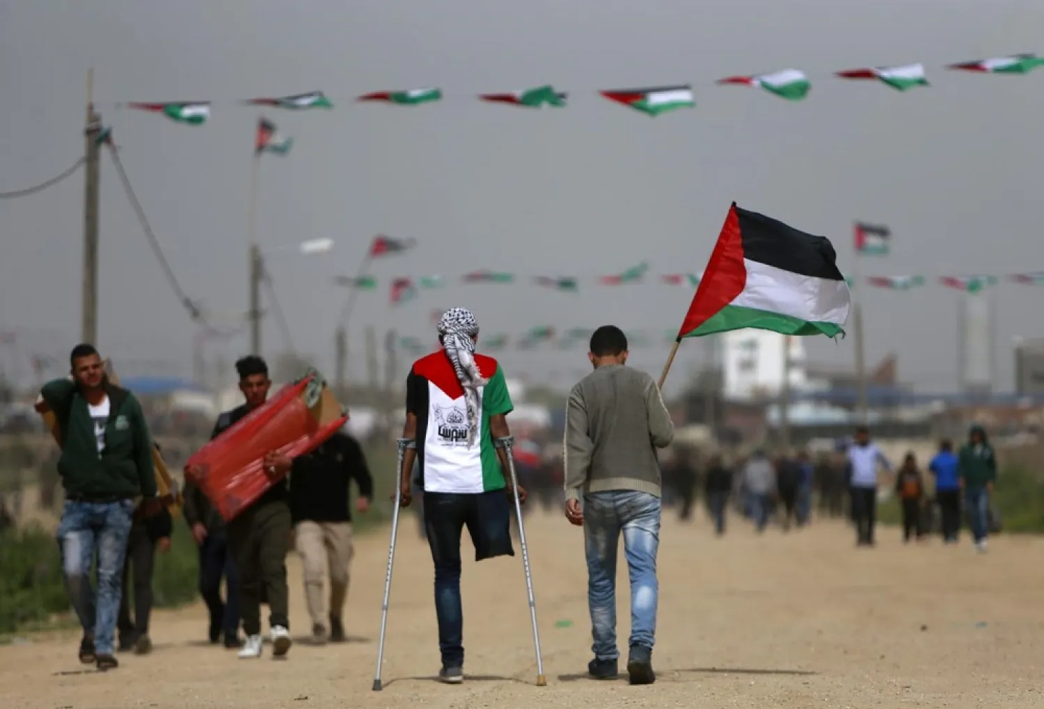 Palestinians head towards a demonstration in March 2019 in Gaza. (AFP)