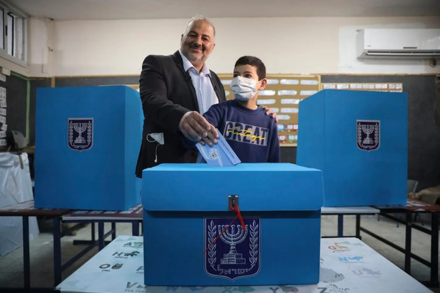 Mansour Abbas, leader of the United Arab List, also known by the Hebrew name Ra’am, votes in Israel’s parliamentary election at a polling station in Maghar, Israel, March 23, 2021. (AP Photo)

