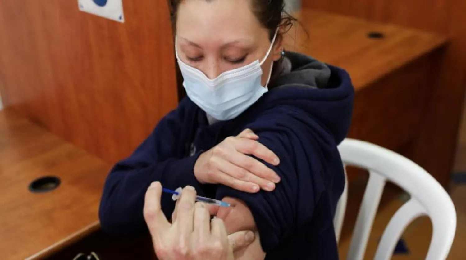 A woman gets vaccinated in Jerusalem. EPA