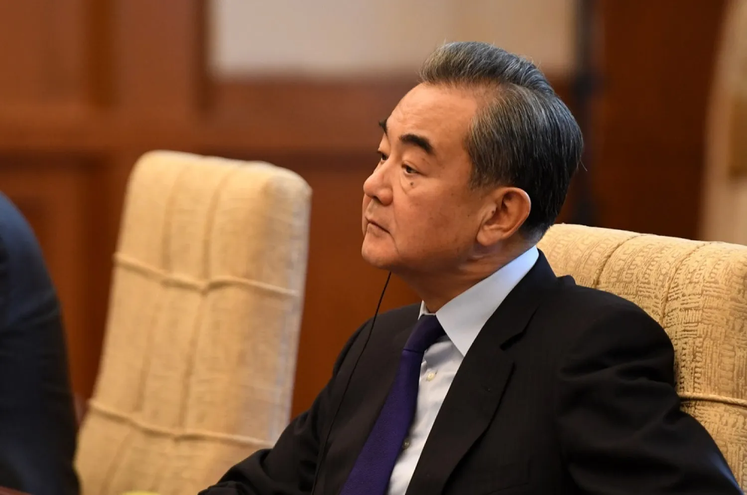 China's Foreign Minister Wang Yi listens to Iran's Foreign Minister Mohammad Javad Zarif during a meeting at the Diaoyutai state guest house in Beijing, China December 31, 2019. (Reuters)