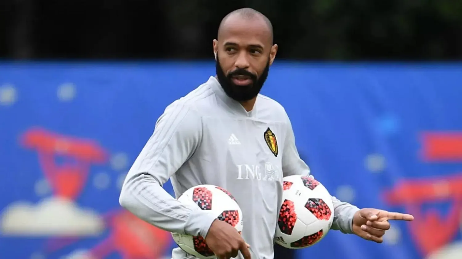 French football legend Thierry Henry watches the Belgian national team during a training session in Russia on July 9, 2018 – the eve of their World Cup semi-final match against France. (AFP)
