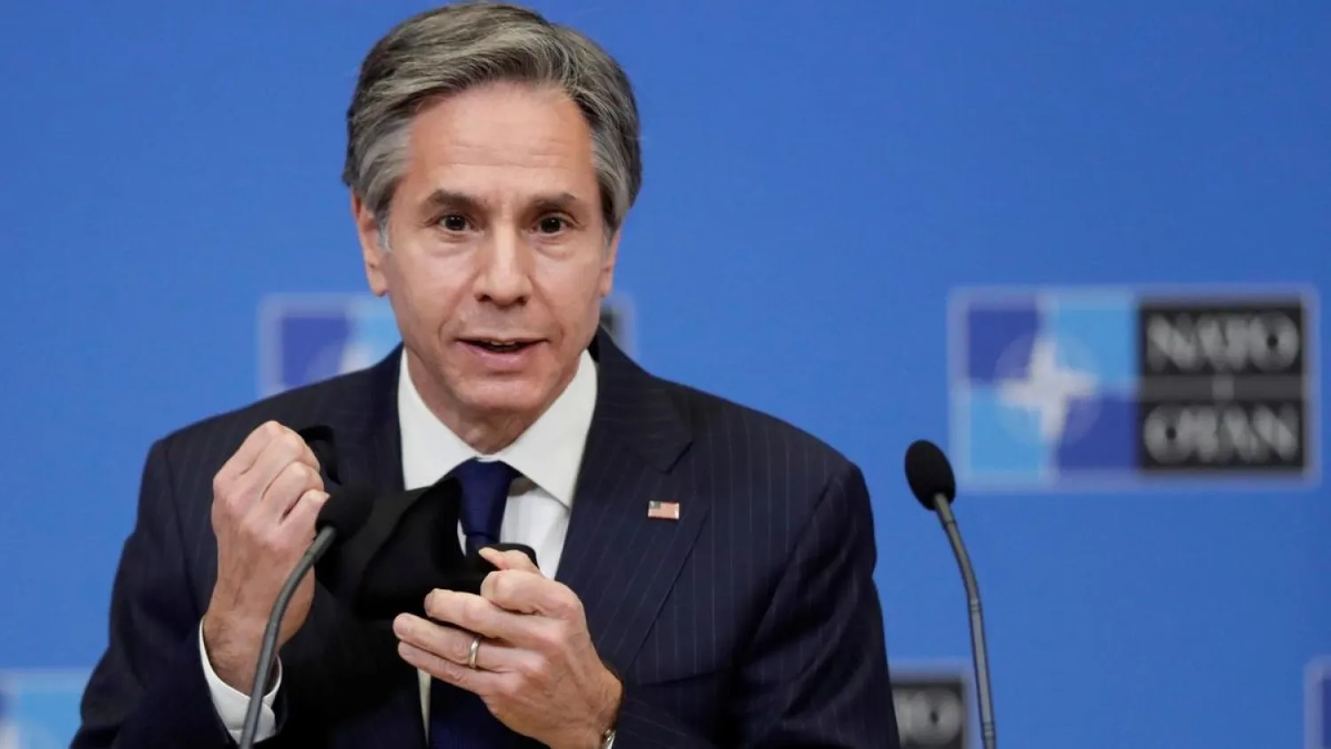 US Secretary of State Antony Blinken removes his mask as gives a press briefing at the end of a NATO Foreign Ministers' meeting. (Reuters)