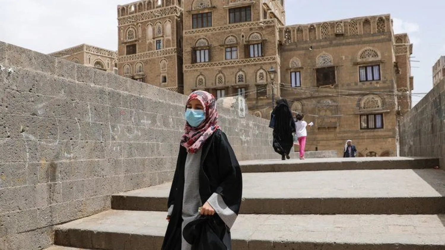 A girl wears a protective face mask amid fears of the spread of the coronavirus disease in Sanaa, Yemen (Reuters)
