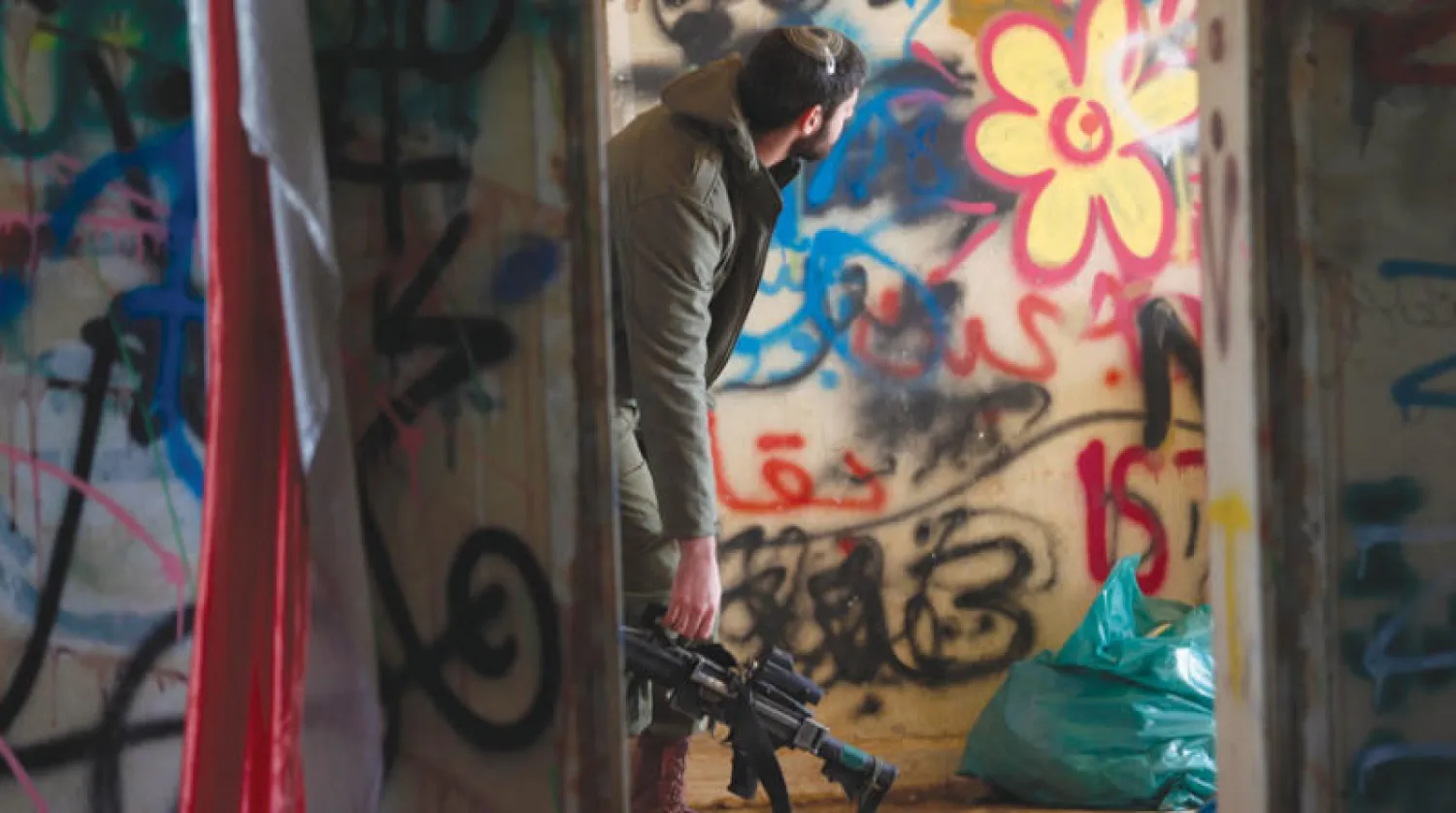 جندي إسرائيلي خلال تدريب عسكري في الجولان السورية المحتلة الشهر الماضي (إ.ب.أ)