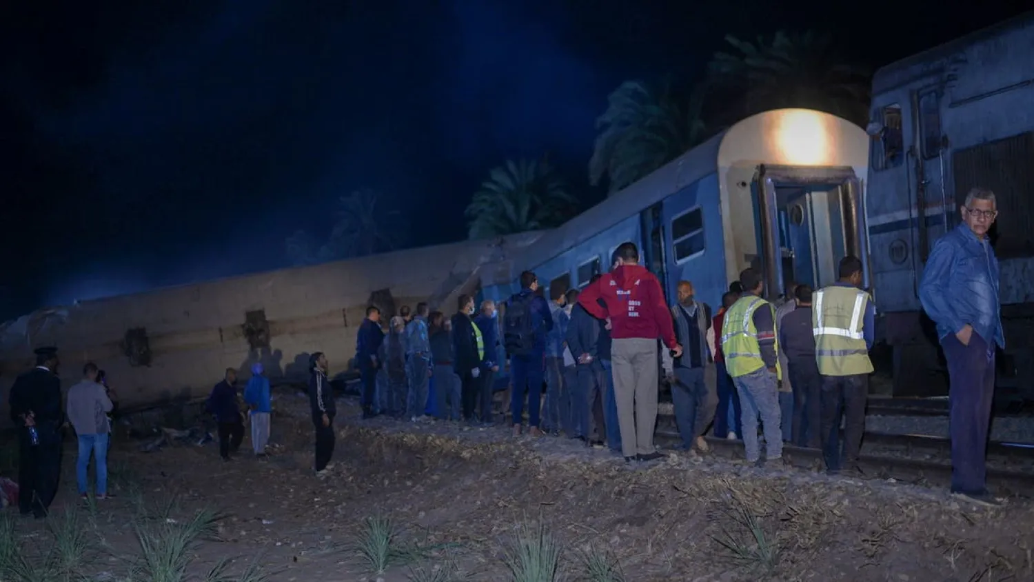 People view the damage after two trains have collided near the city of Sohag, Egypt, March 26, 2021. Picture taken March 26, 2021. (Reuters)

