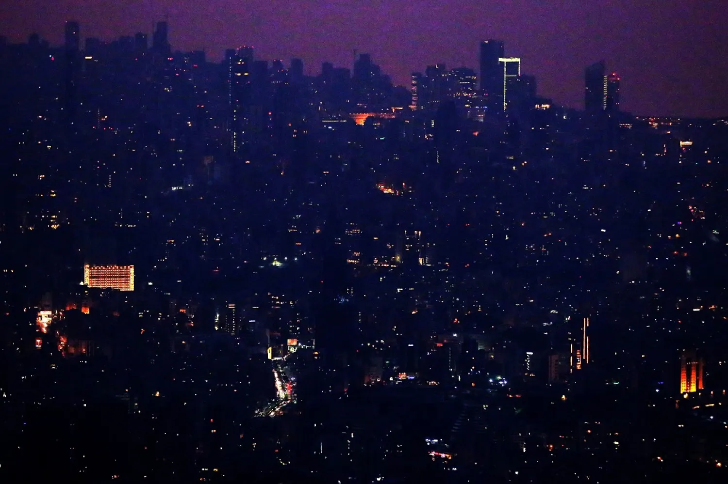 Lebanon's capital, Beirut, in the dark on July 27, 2020, due to widespread electricity blackouts caused by fuel shortages in the midst of a dire economic crisis. (Getty Images)