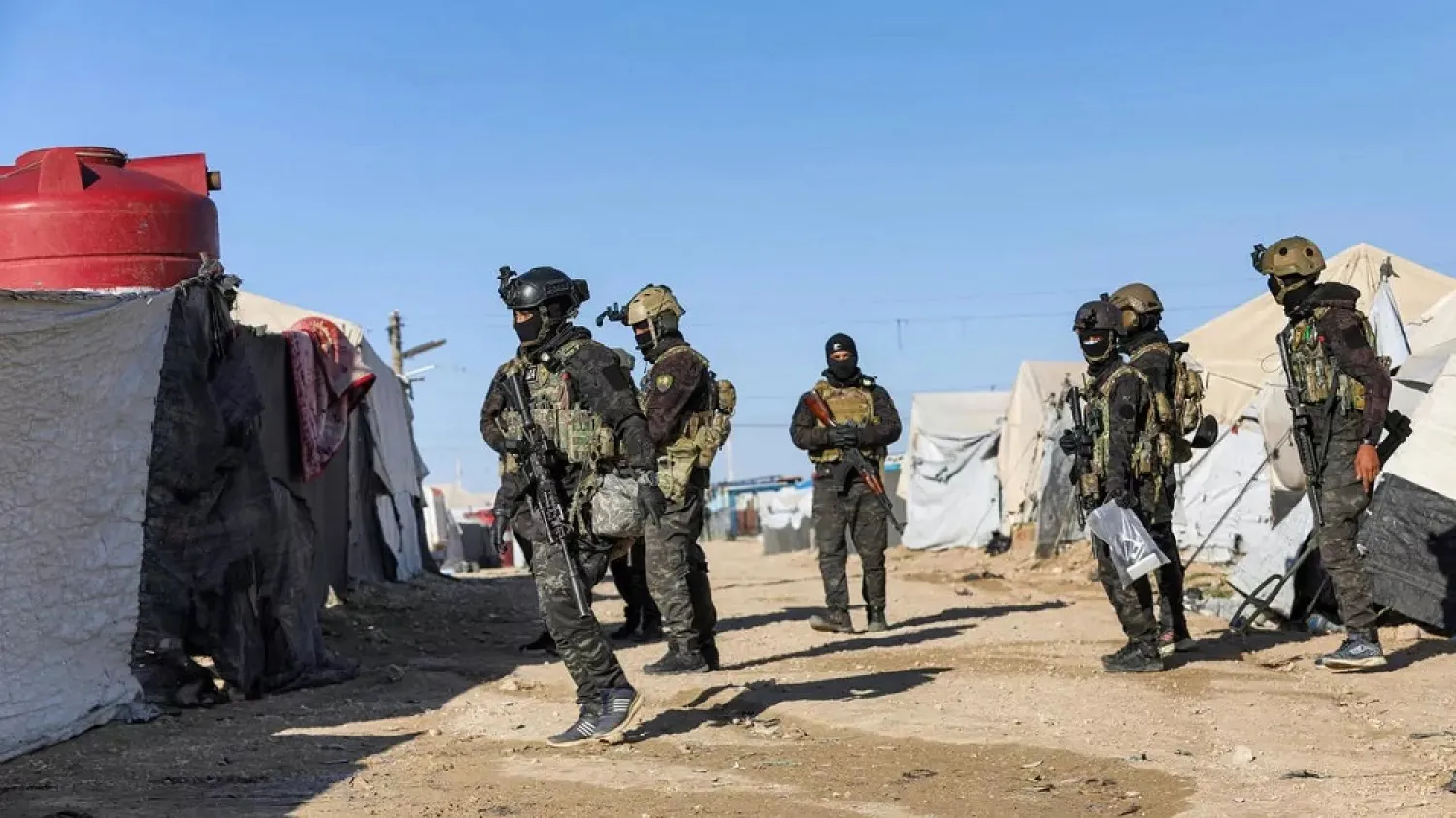 Syrian Kurdish forces carry out a security operation at Al-Hol camp in northeast Syria. (AFP)