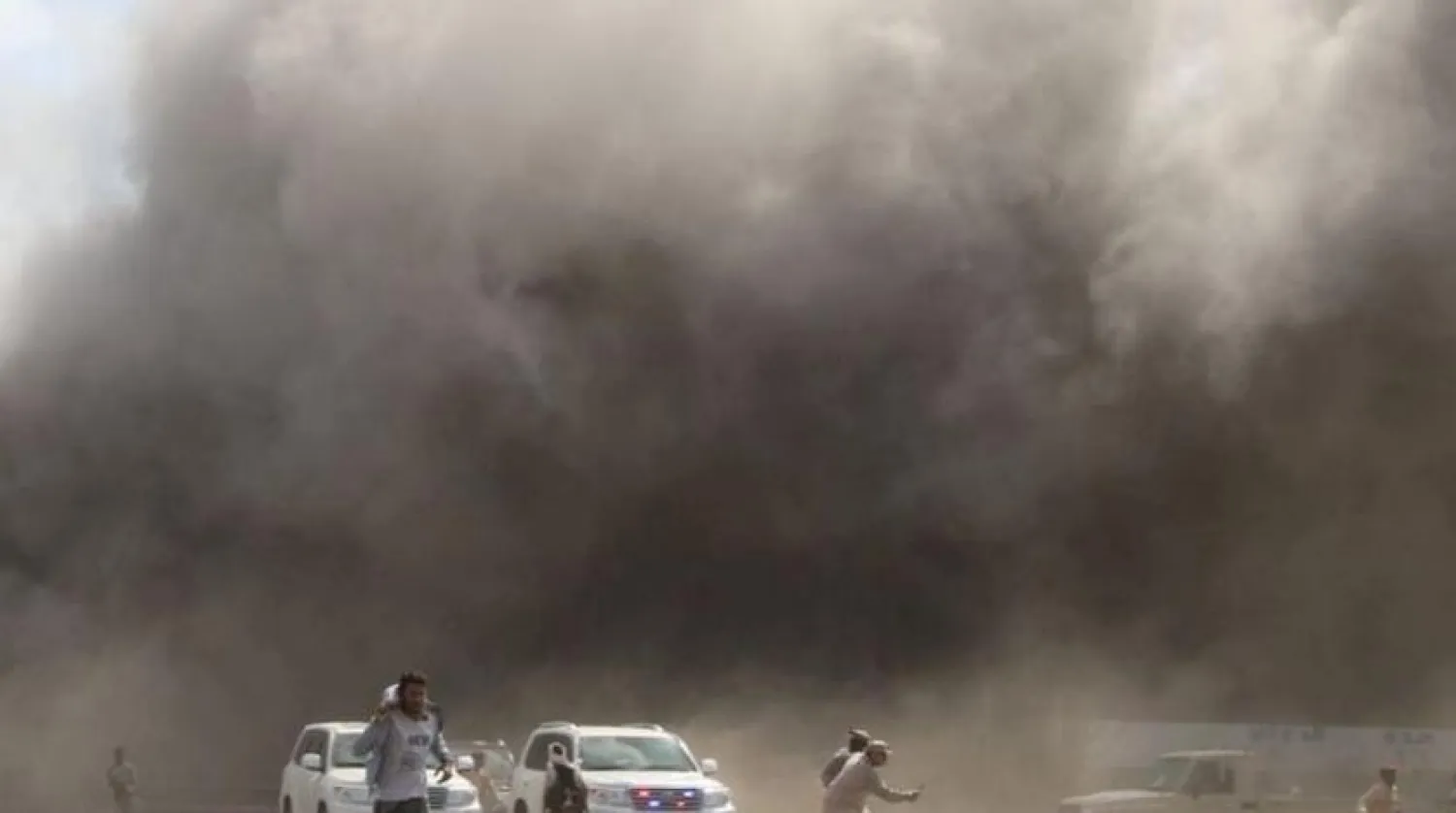 Dust rises after the attack on Aden airport. (Reuters)