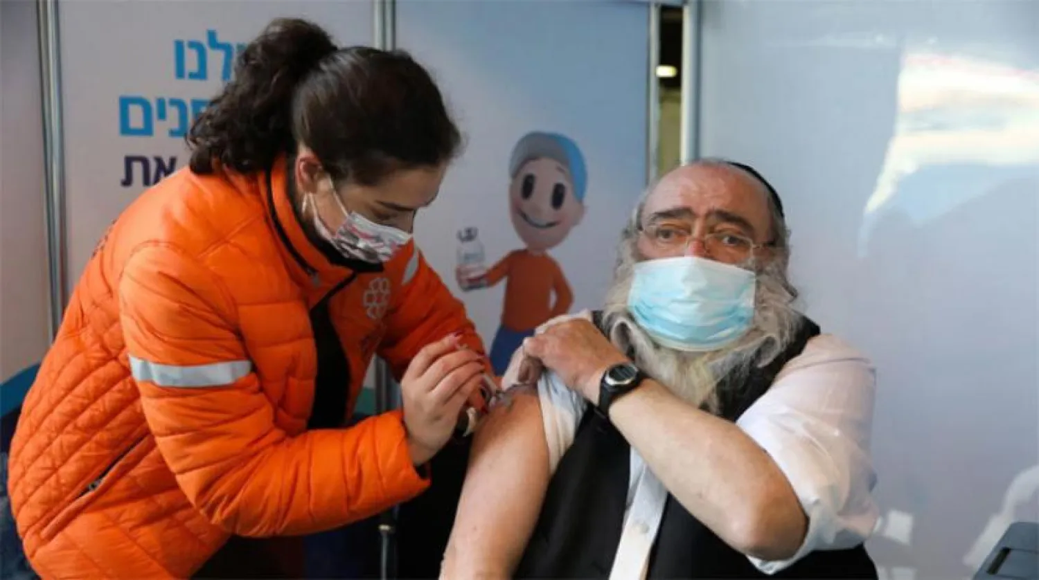 A man gets vaccinated in Jerusalem