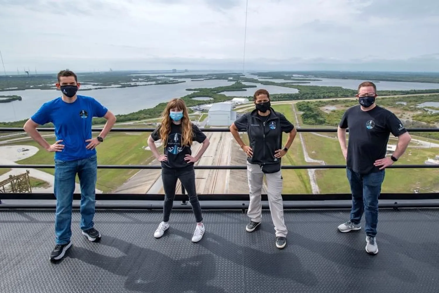 Jared Isaacman, Hayley Arceneaux, Sian Proctor and Chris Sembroski pose for a photo at the SpaceX launch tower at NASA's Kennedy Space Center at Cape Canaveral, Florida US, March 29, 2021 in this handout image provided by SpaceX. (Handout via Reuters)