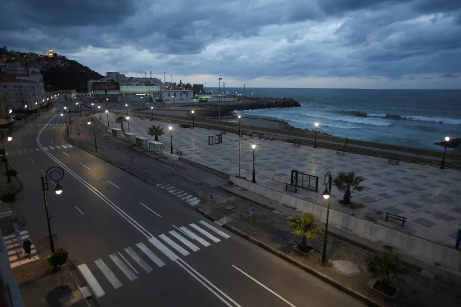A general view shows an empty street during a curfew to prevent the spread of the coronavirus disease (COVID-19), in Algiers. Reuters file photo