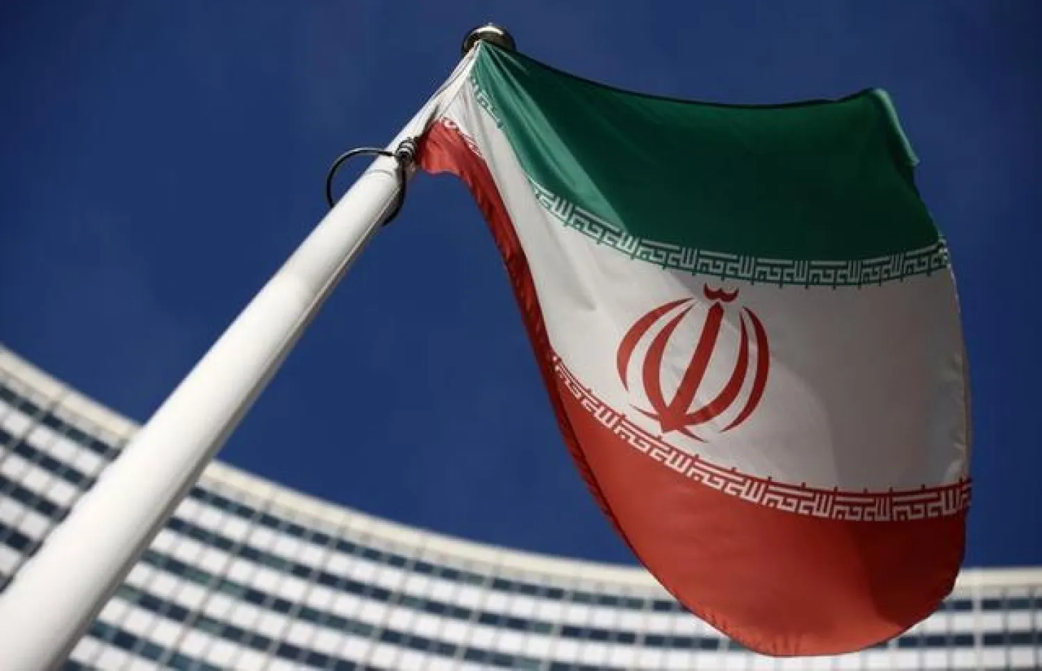 FILE PHOTO: The Iranian flag waves in front of the International Atomic Energy Agency (IAEA) headquarters, before the beginning of a board of governors meeting, amid the coronavirus disease (COVID-19) outbreak in Vienna, Austria, March 1, 2021. REUTERS/Lisi Niesner