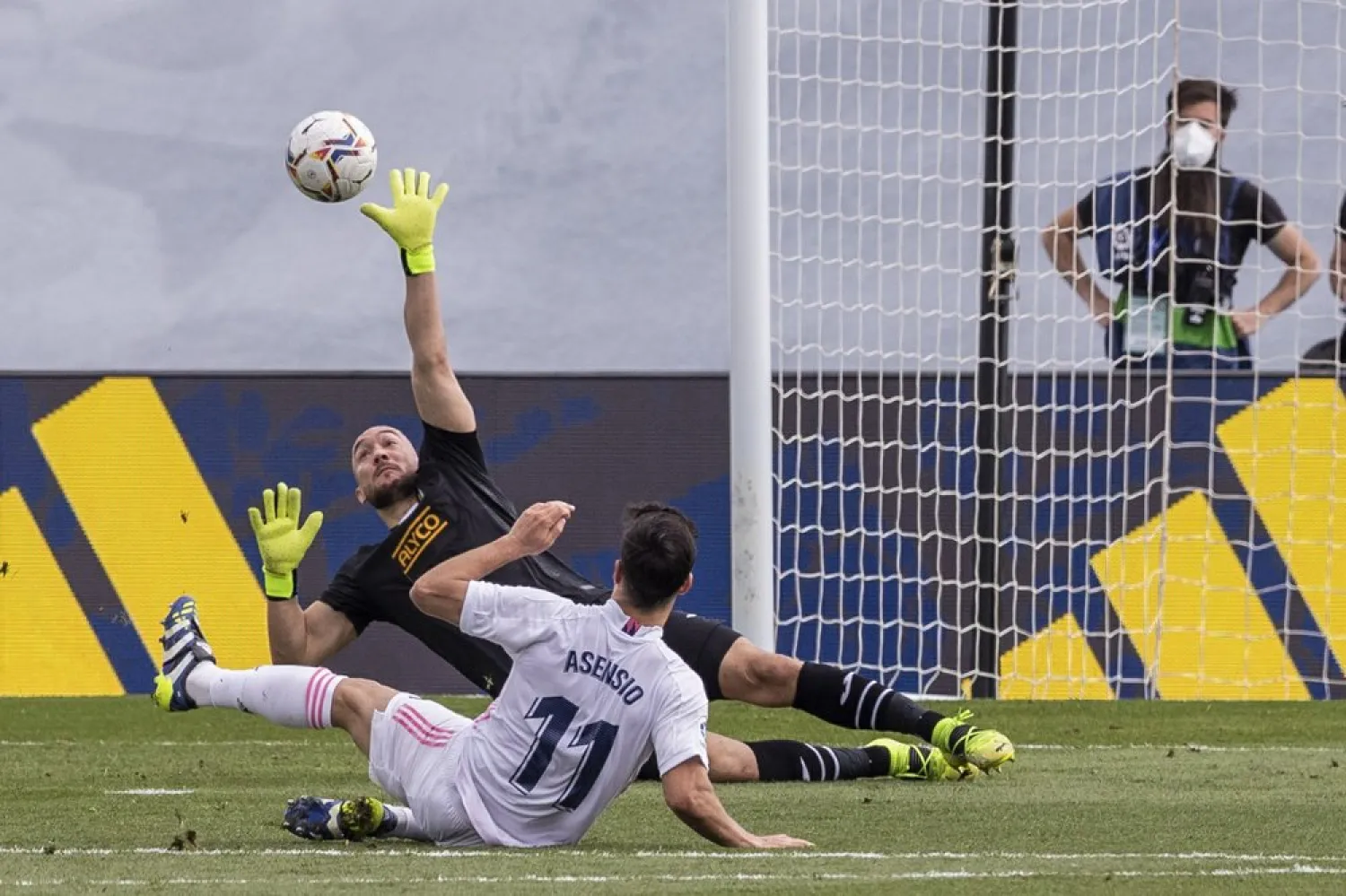 Real Madrid's Marco Asensio scores the opening goal during the La Liga match against Eibar at the Alfredo di Stefano stadium in Madrid, Spain, Saturday, April 3, 2021. (AP)