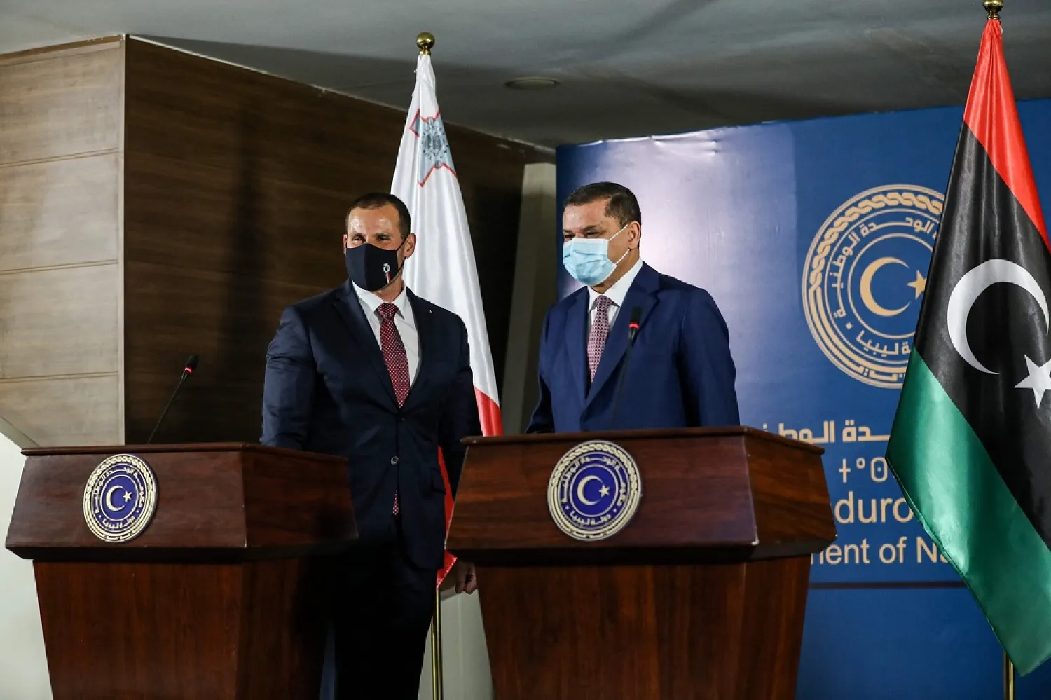 Malta's Prime Minister Robert Abela (L) and GNU chief Abdulhamid Dbeibeh give a joint press conference at the prime minister's office in Tripoli, Libya, April 5, 2021. (AFP)