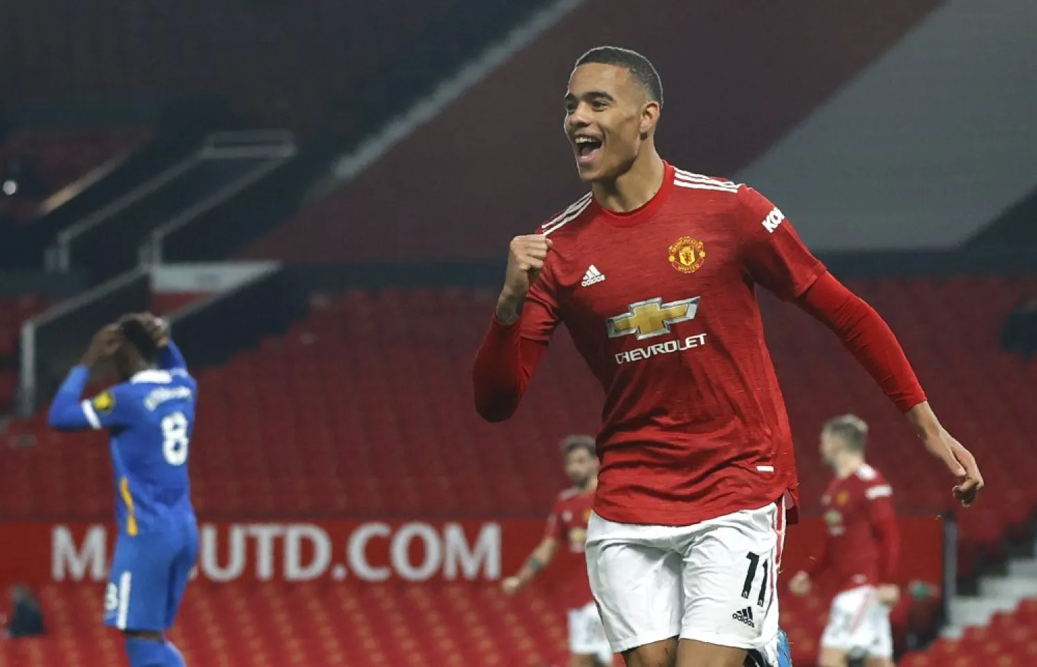 Manchester United's Mason Greenwood celebrates after scoring his side's second goal during the match against Brighton and Hove Albion at Old Trafford, Manchester, England, Apr. 4, 2021. (AP)
