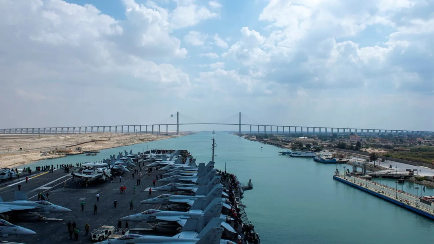 United States Navy aircraft carrier USS Dwight D. Eisenhower (CVN 69) approaches the Friendship Bridge during a Suez Canal transit in this picture taken April 2, 2021 and released by US Navy on April 3, 2021. (Reuters)
