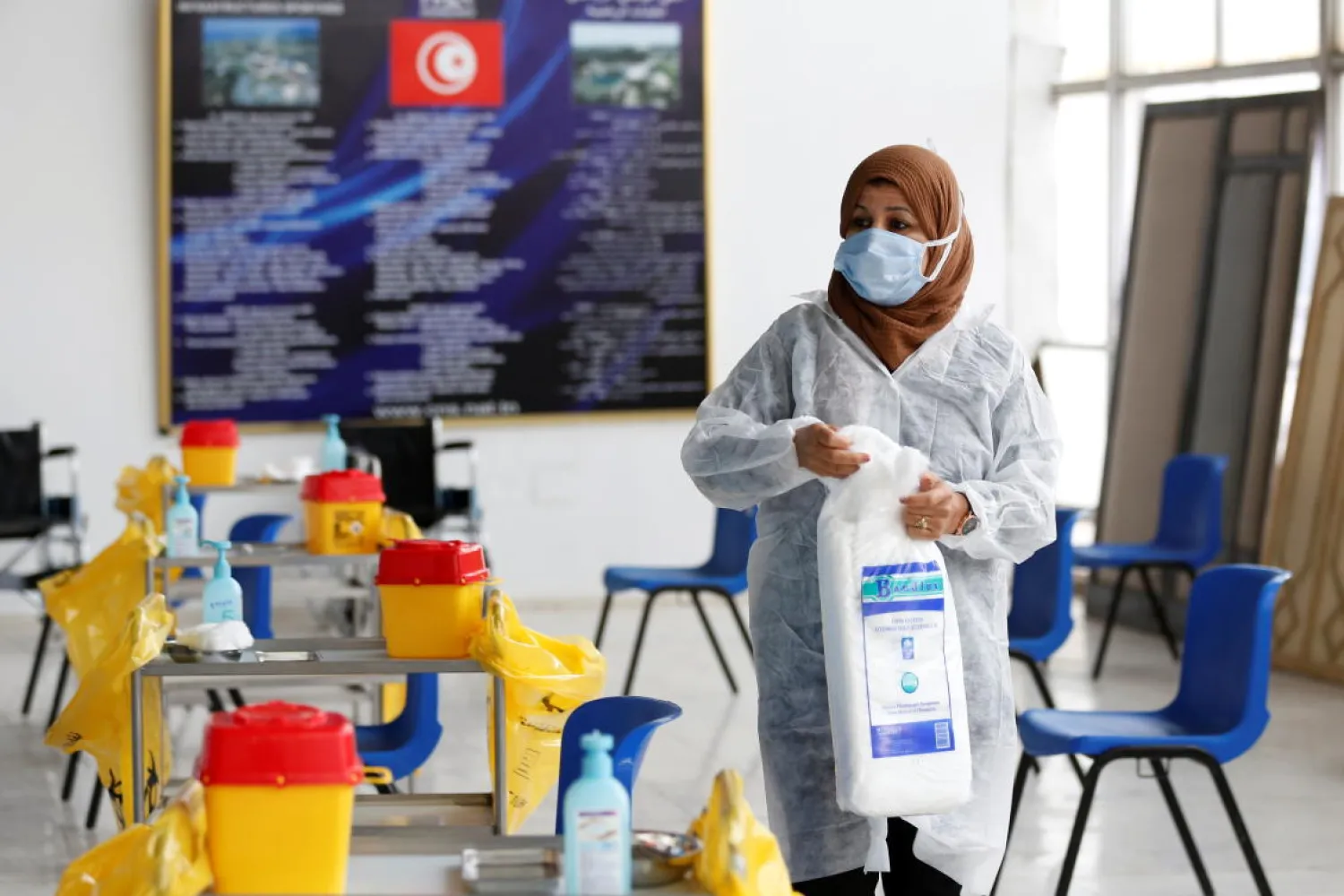 A Tunisian health worker prepares to receive people for a vaccination against the coronavirus disease (COVID-19), in Tunis, Tunisia March 13, 2021. (Reuters)