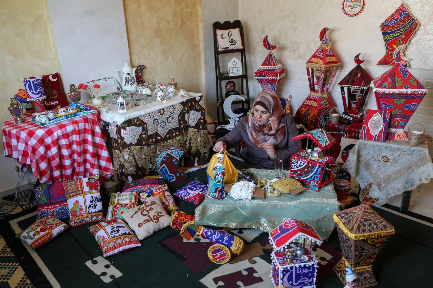 Palestinian Hanan Al-Madhoon makes decorations for sale ahead of the holy fasting month of Ramadan, at Beach refugee camp in Gaza City. (Reuters)

