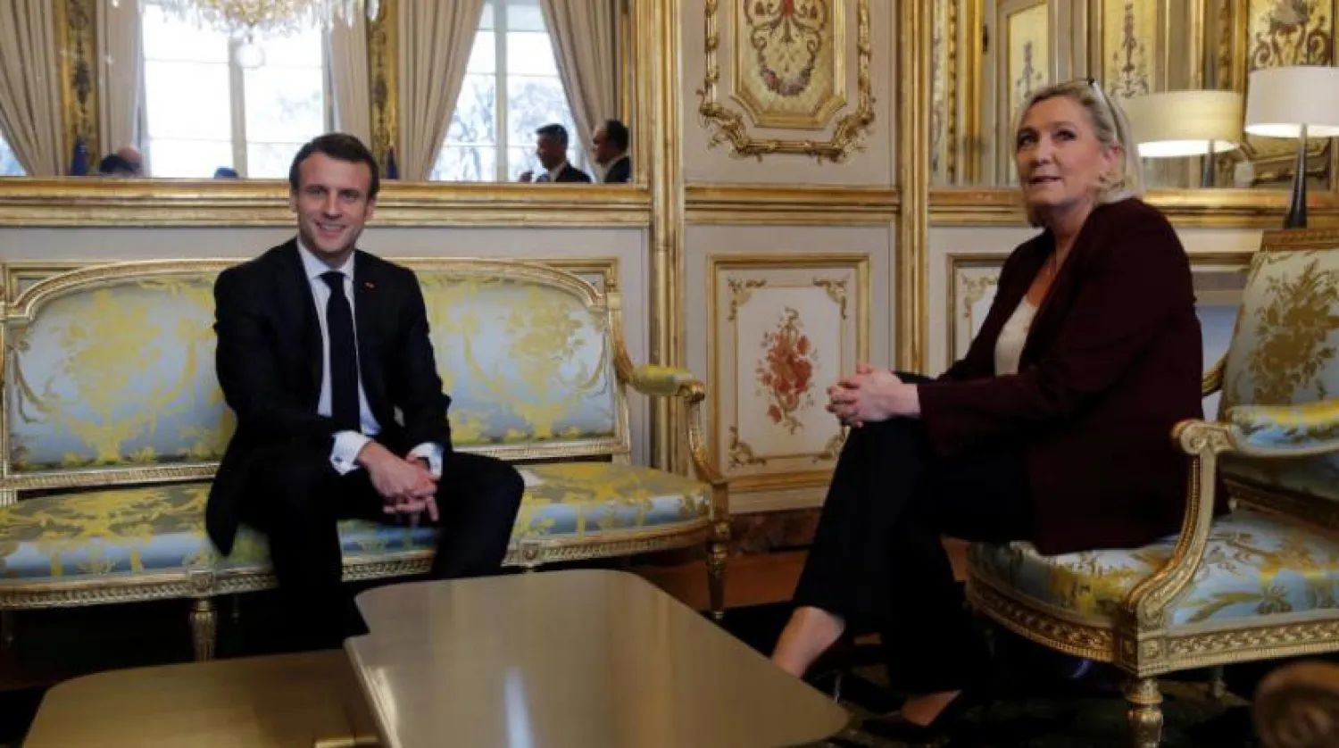 Fransa Cumhurbaşkanı Emmanuel Macron ve Ulusal Birlik Partisi lideri Marine Le Pen (Reuters-Arşiv)