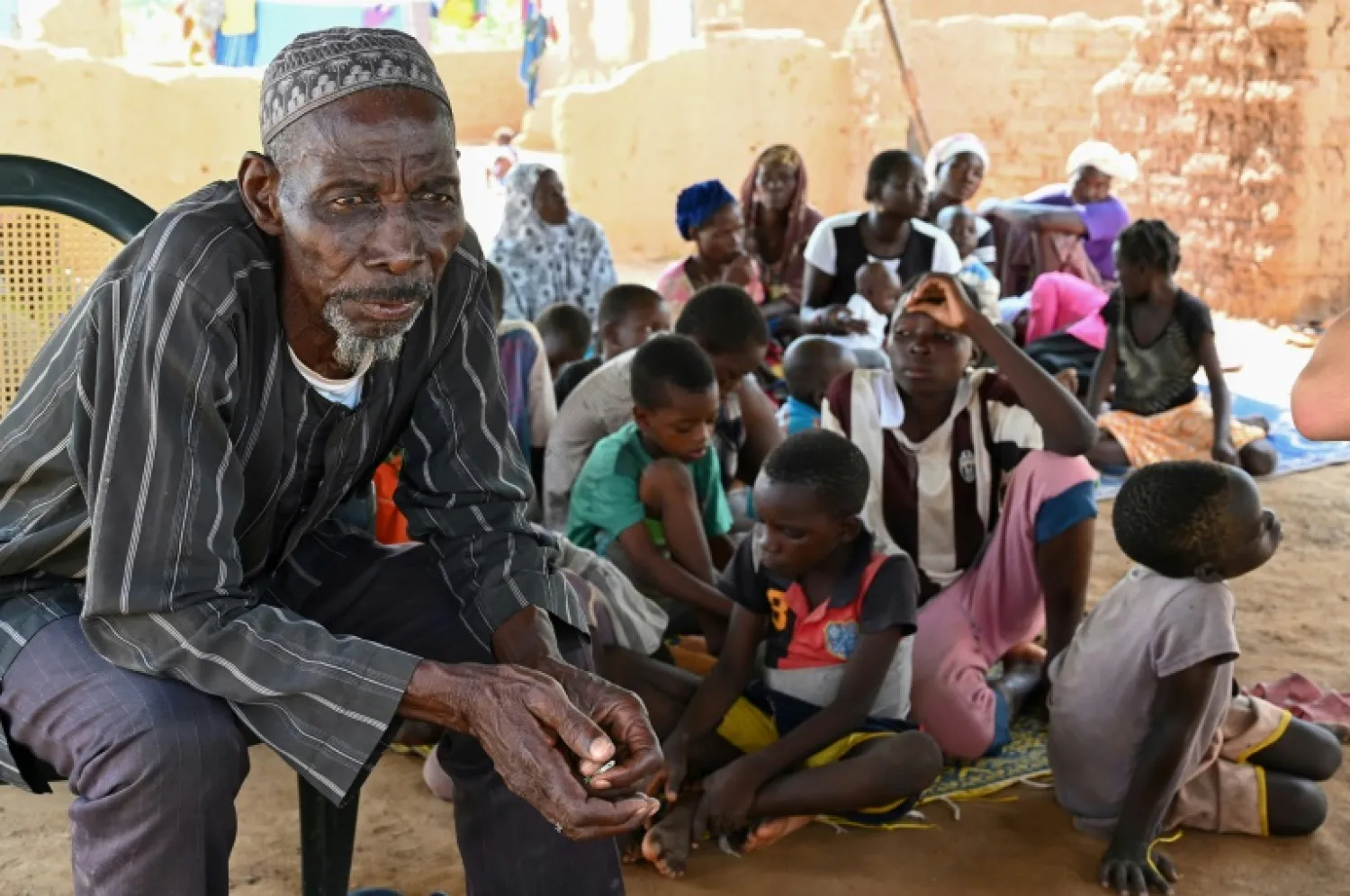 Belem Boureima, a 74-year-old farmer, and his family. They are among more than a million people who have fled their homes since Burkina Faso's militant insurgency began in 2015 | AFP