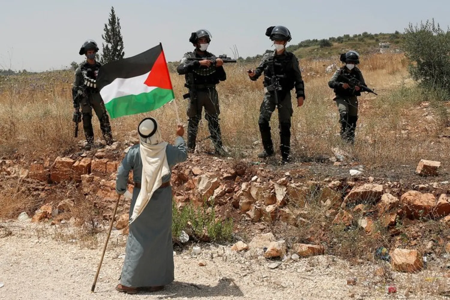 A Palestinian protests Israel’s plan to annex parts of the occupied West Bank, near Tulkarm. (Reuters)
