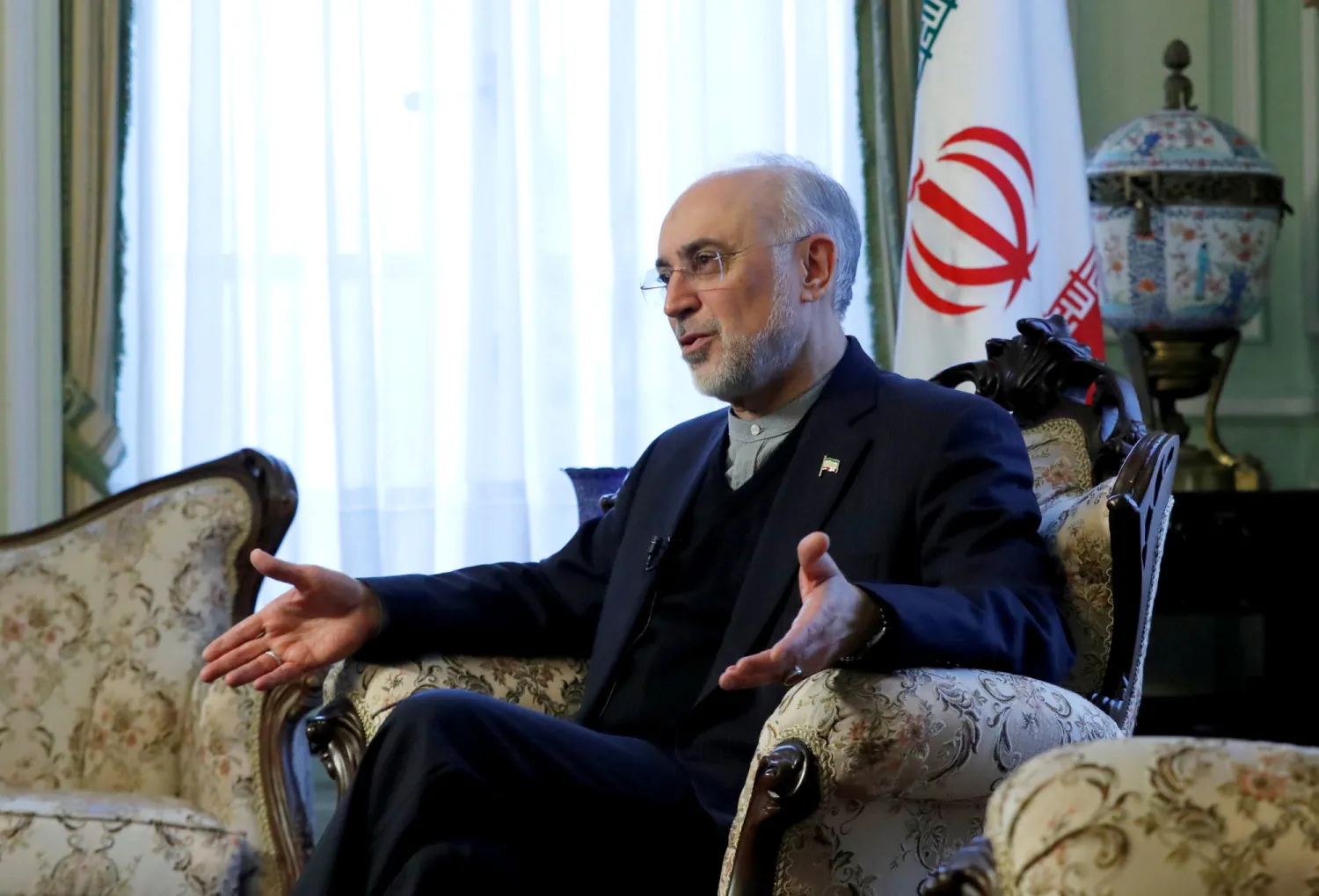 Iran's nuclear chief, Ali Akbar Salehi, gestures as he speaks to Reuters during an interview in Brussels. File photo