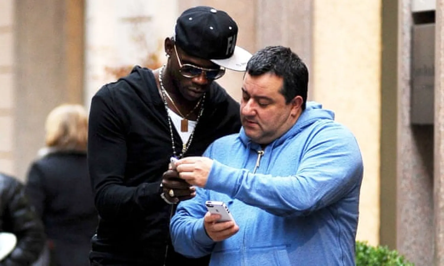 Mino Raiola (right), pictured with Mario Balotelli in Milan in 2013, is the most powerful agent in the modern game and is currently brokering a deal for Erling Haaland. Photograph: Olycom SPA/Shutterstock
