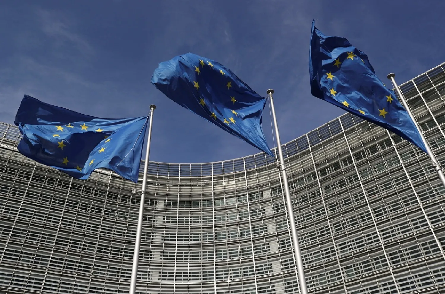 European Union flags flutter outside the European Commission headquarters in Brussels, Belgium, March 24, 2021. (Reuters)