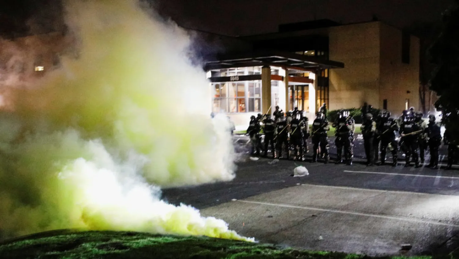 Officers in riot gear fired rubber bullets and lobbed flash bangs at protesters and let off clouds of chemical irritants. (Reuters)