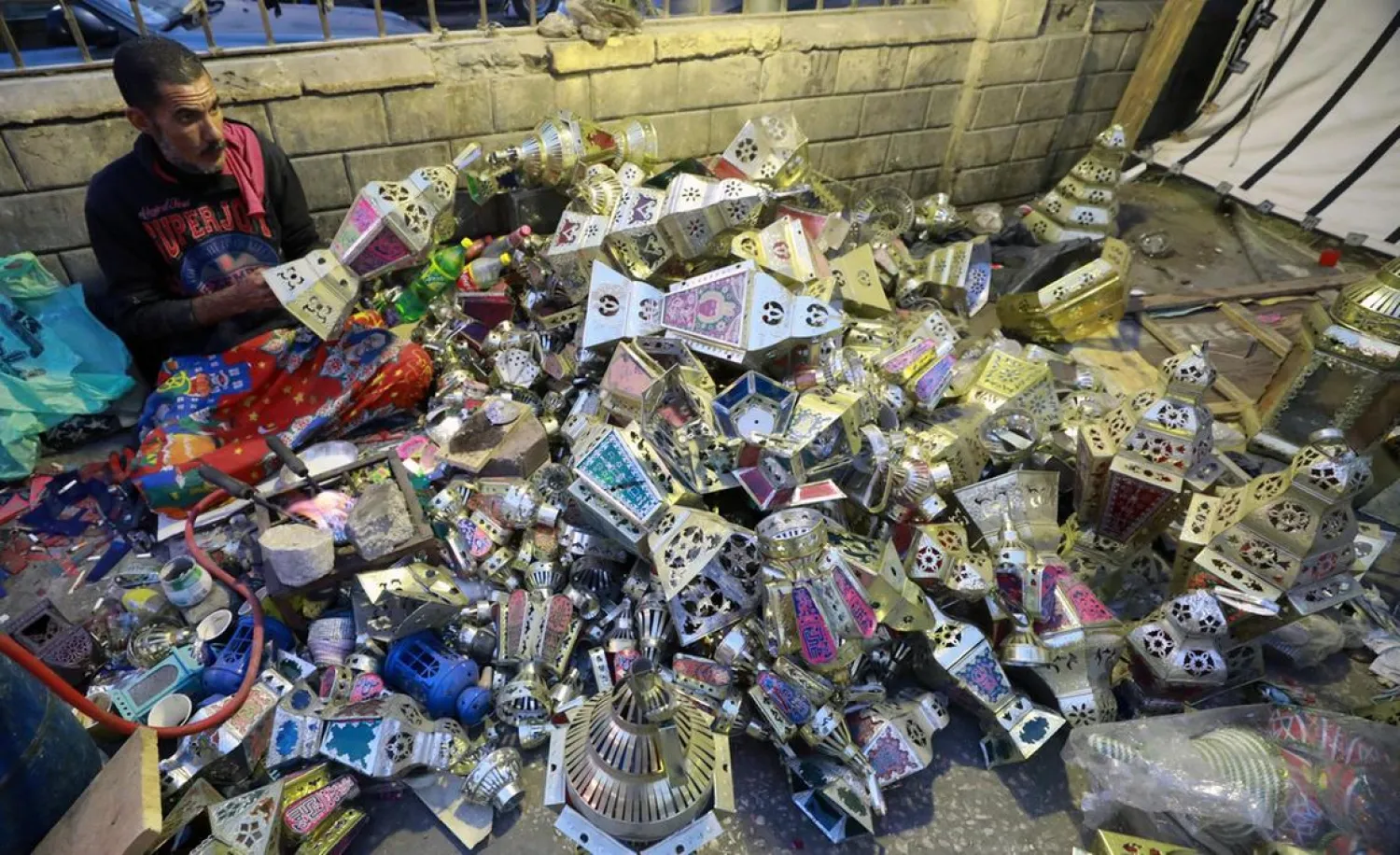An Egyptian craftsman makes traditional Ramadan lanterns, called Fanous, at a workshop in the capital city of Cairo. (EPA)