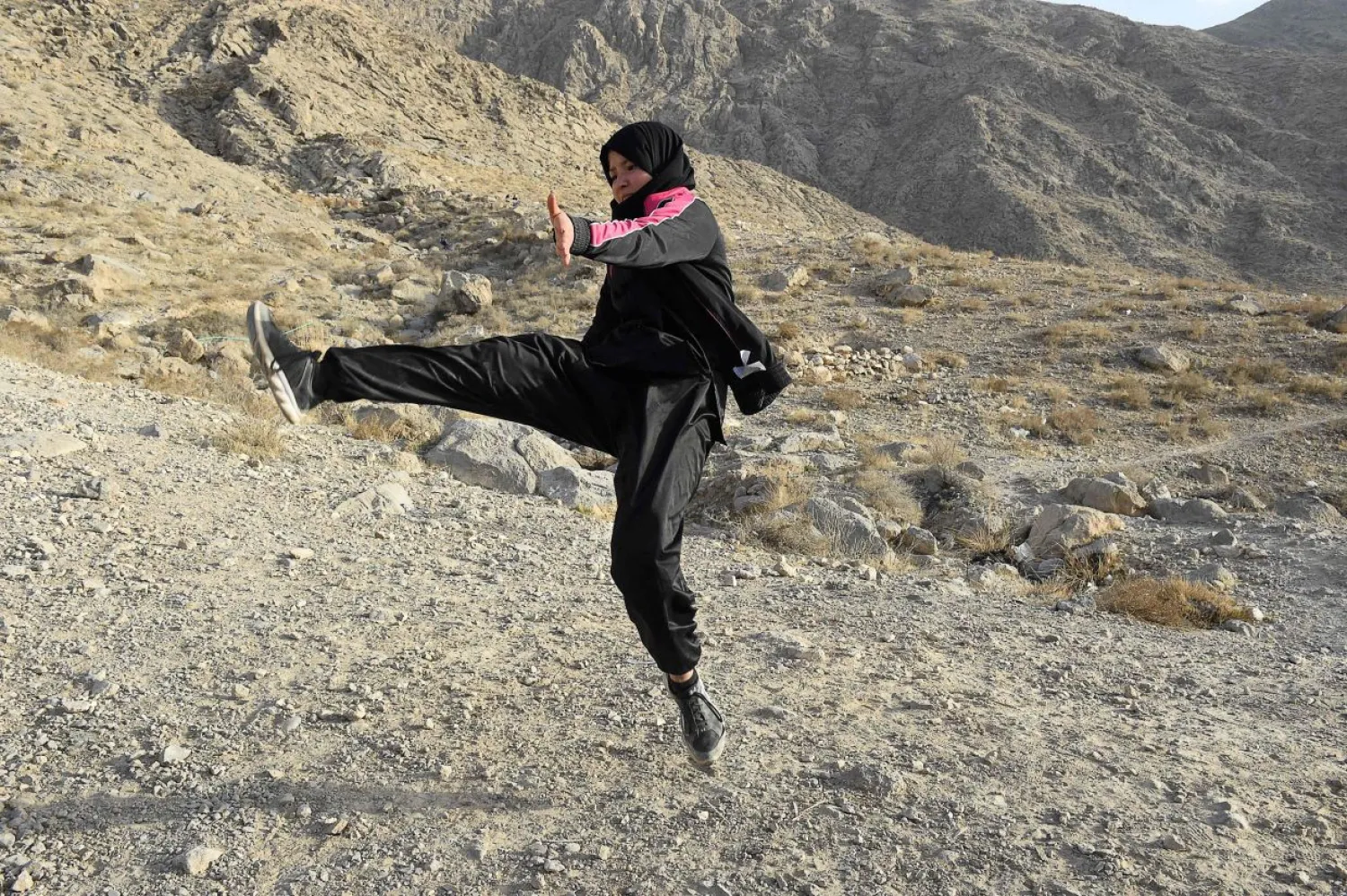 A female student of the Hazara community practices Shaolin Kung Fu during a self-defense martial arts training class, on the outskirts of Quetta. AFP