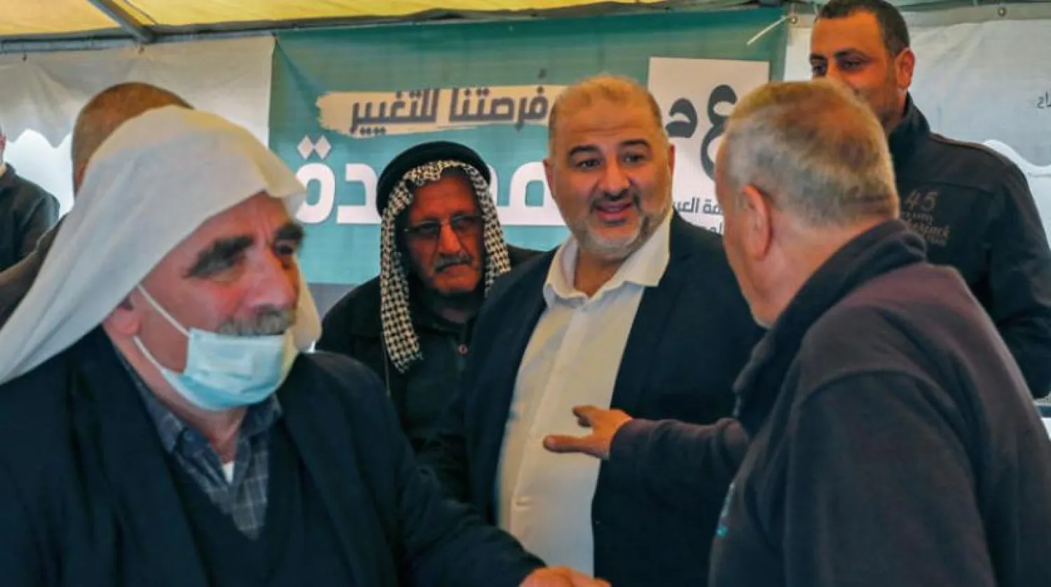 Arab Israelis in the Galilee congratulate Mansour Abbas on his victory in the elections (AFP) 

