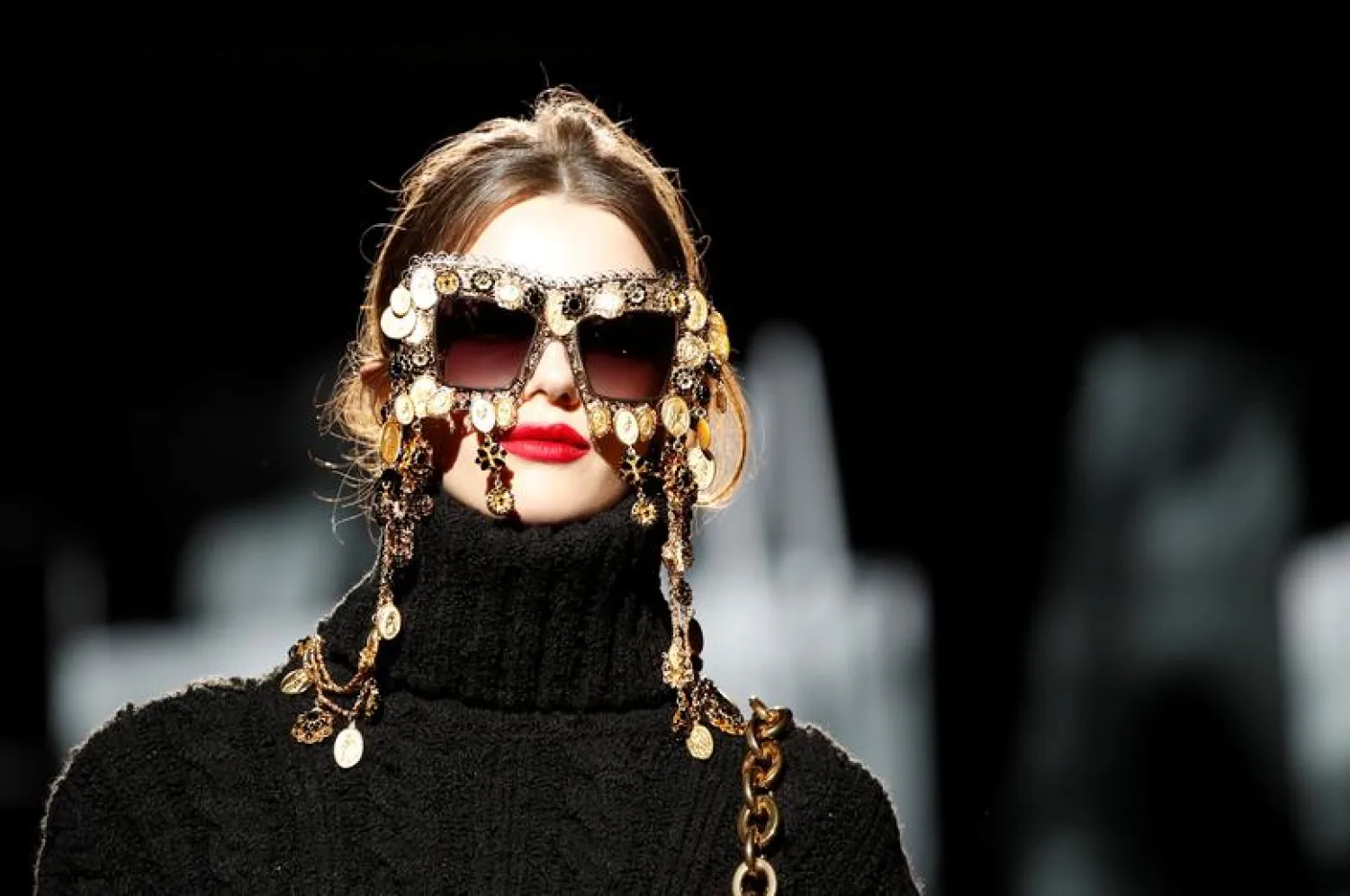 FILE: A model presents a fashion creation. REUTERS/Alessandro Garofalo

