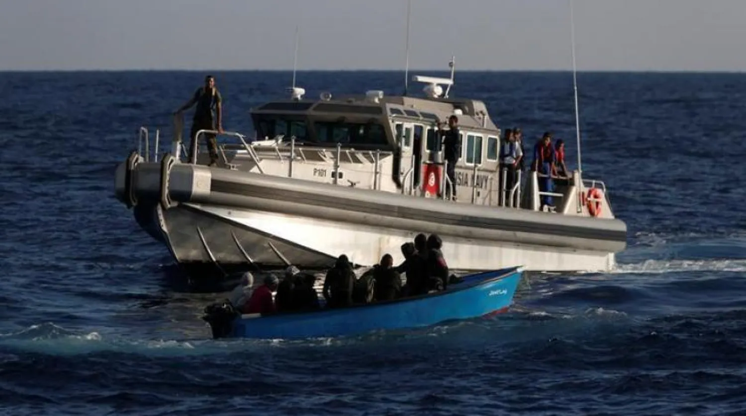 Migrants aboard a wooden boat being rescued by the Tunisian coastguard. Reuters file photo