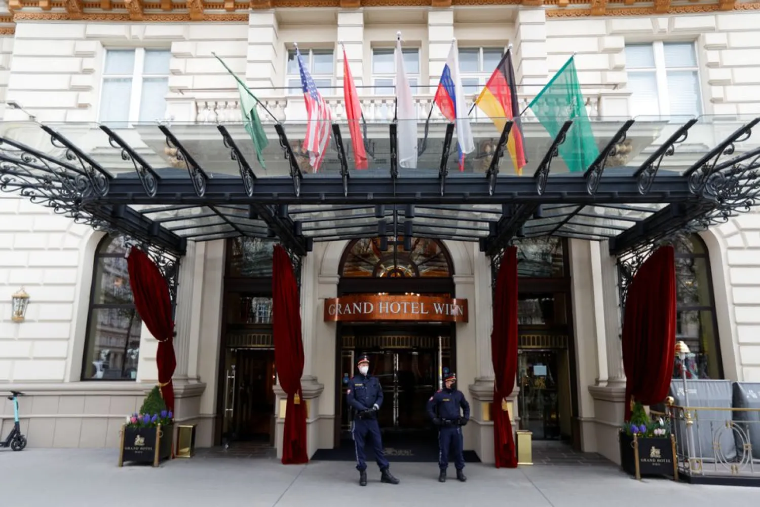 Police officers stand outside a hotel, where a meeting of the JCPOA Joint Commission or Iran nuclear deal will be held, in Vienna, Austria, April 15, 2021. REUTERS/Leonhard Foeger