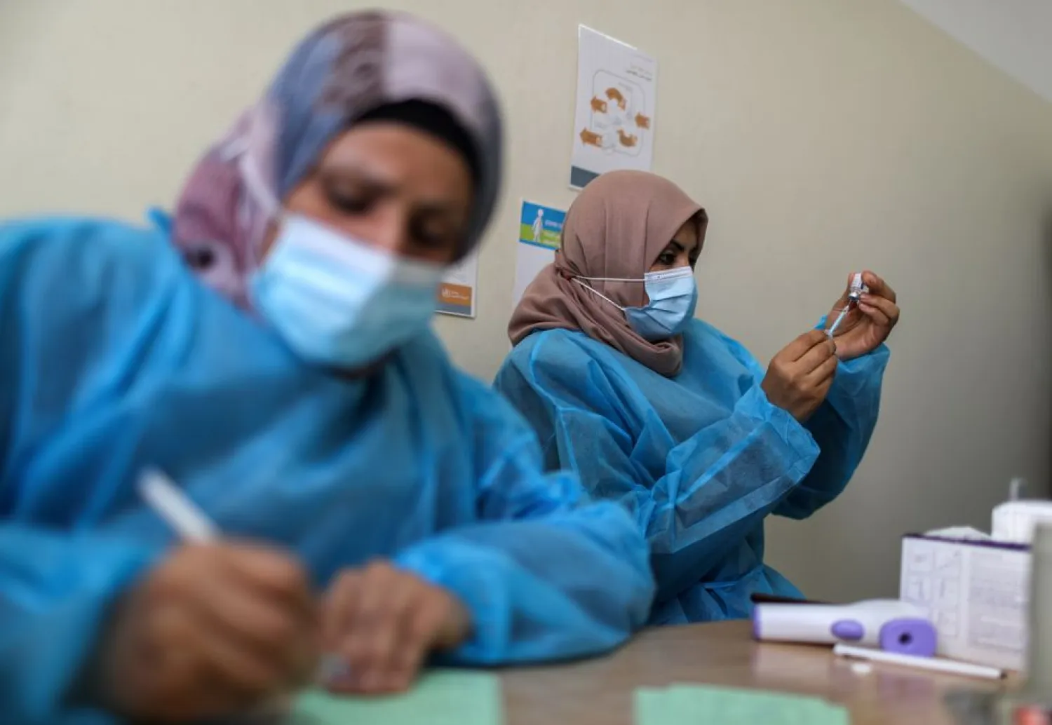 A health worker prepares a vaccination against the coronavirus disease (COVID-19), in Gaza City March 17, 2021. (Reuters)