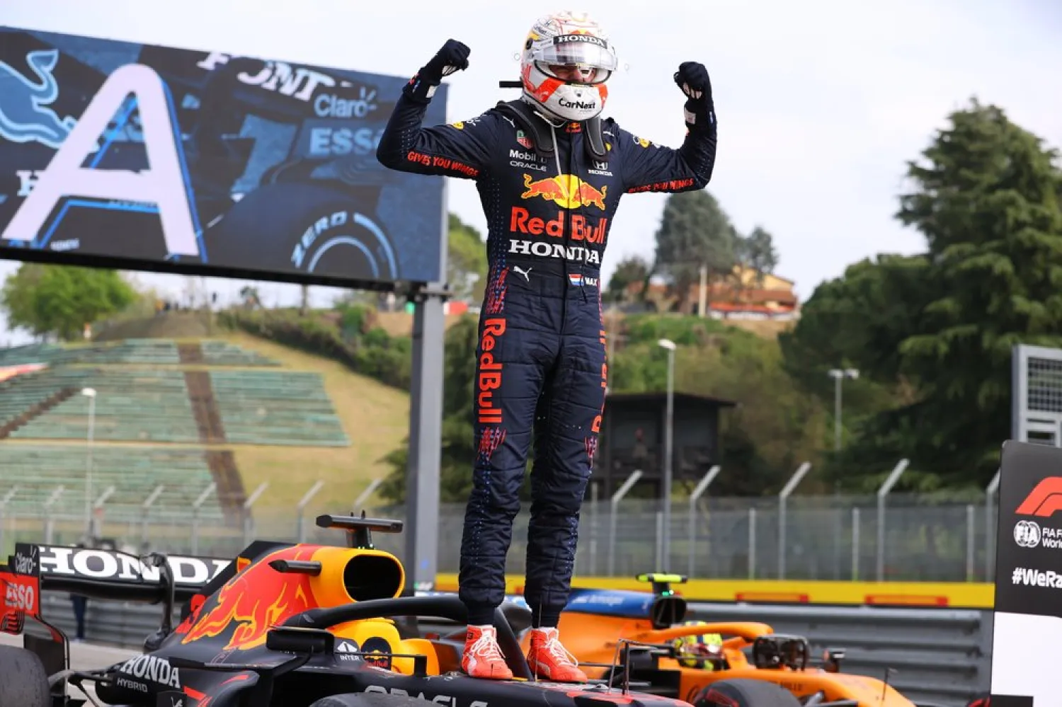 First placed Red Bull's Max Verstappen celebrates at the end of the Emilia Romagna Formula One Grand Prix, at the Imola racetrack, Italy, Sunday, April 18, 2021. (AP)