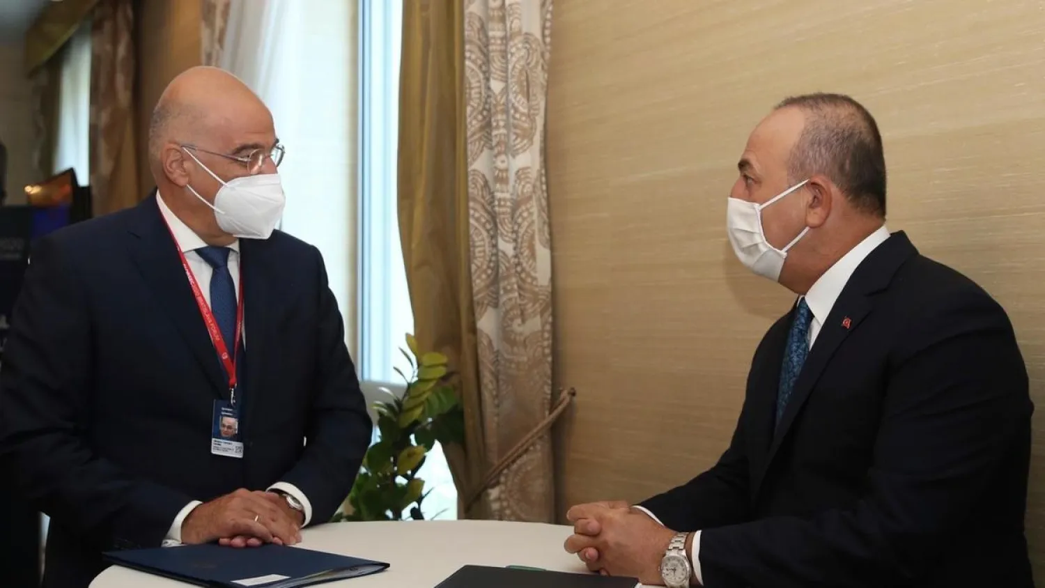 Greek Foreign Minister Nikos Dendias, left, meets with Turkey's Foreign Minister Mevlut Cavusoglu, on the sidelines of a conference in Bratislava, Slovakia. (AP file photo)