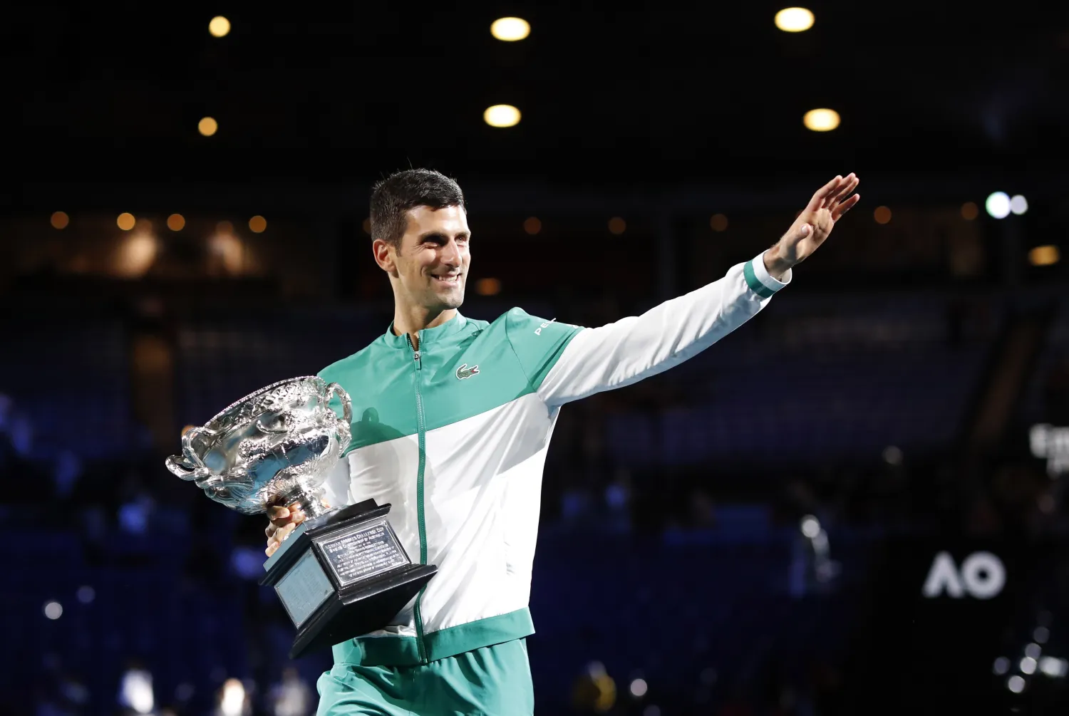 Tennis - Australian Open - Men's Singles Final - Melbourne Park, Melbourne, Australia, February 21, 2021 Serbia's Novak Djokovic celebrates with the trophy after winning his final match against Russia's Daniil Medvedev REUTERS/Asanka Brendon Ratnayake