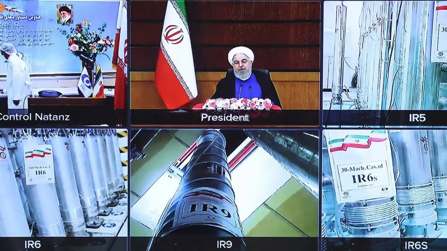 A picture provided by the Iranian presidential office on April 10 shows a screen grab from a videoconference with views of Iran's Natanz uranium enrichment plant as well as Iranian President Hassan Rouhani delivering a speech. (Iranian Presidency/AFP file photo)