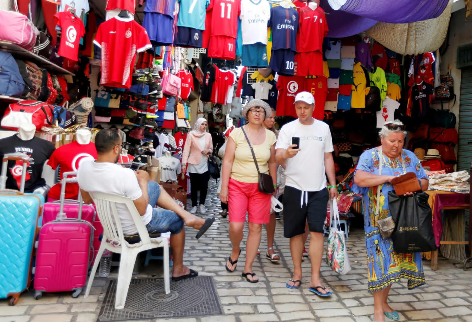 Tourists are seen shopping at the old medina in Sousse, Tunisia, June 22, 2018. (Reuters)
