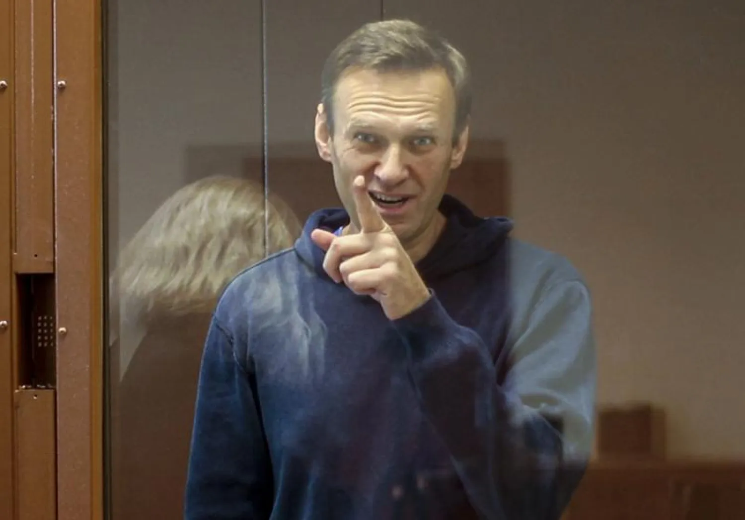 FILE - In this Feb. 16, 2021, file photo taken from footage provided by the Babuskinsky District Court, Russian opposition leader Alexei Navalny gestures during a court hearing in Moscow, Russia. S...
