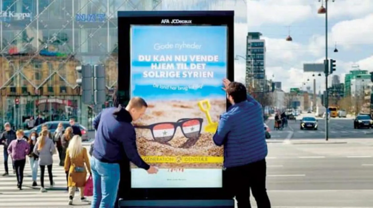 An ad board urging Syrian refugees to return to their country in Copenhagen, Denmark, Asharq Al-Awsat  
