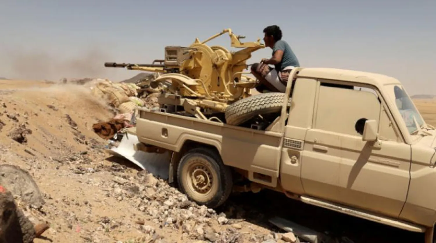 FILE PHOTO: A Yemeni government fighter fires a vehicle-mounted weapon at a frontline position during fighting against Houthis in Marib, Yemen March 28, 2021. REUTERS/Ali Owidha/File Photo
