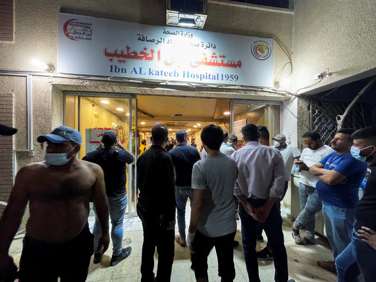 People gather inside Ibn Khatib hospital after a fire caused by an oxygen tank explosion in Baghdad, Iraq, April 25, 2021. REUTERS/Thaier Al-Sudani


