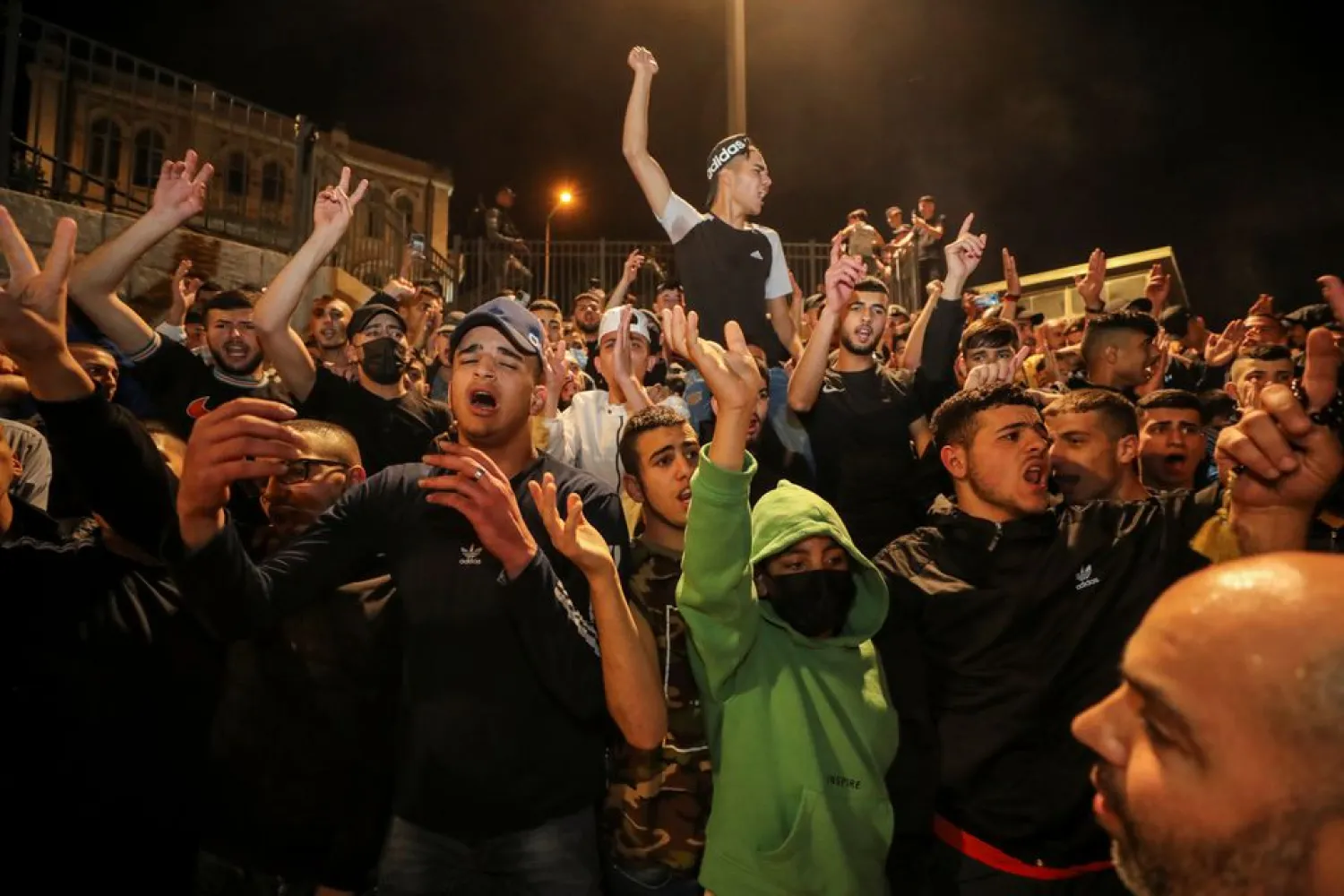 Palestinians celebrate outside Damascus Gate after barriers that were put up by Israeli police are removed, allowing access to the main square that has been the focus of a week of clashes around Jerusalem's Old City April 25, 2021. (Reuters)