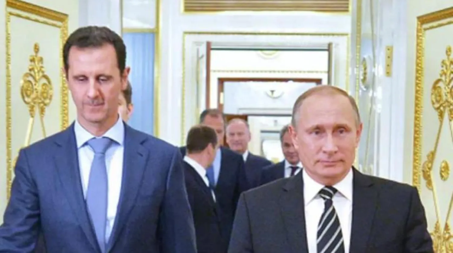 Putin ve Esed’in 2015 yılında Kremlin'de birlikte çekilen bir fotoğrafı (AFP)