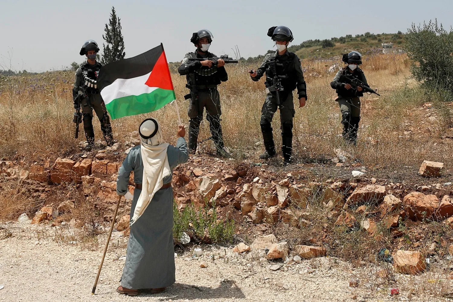 A demonstrator confronts Israeli forces during a protest against Israel’s plan to annex parts of the occupied West Bank, Tulkarm, June 5, 2020. (Reuters)